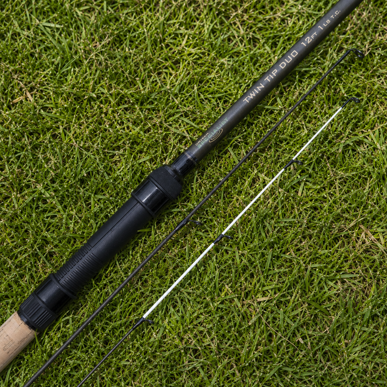 Drennan Specialist Twin Tip Duo 12ft 1.25lb test curve fishing rod with interchangeable tip sections on grass.